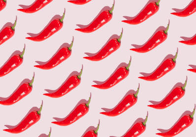 paprike_pattern-2 Pozadinski uzorka od crvenih paprika na roze pozadini.