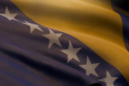 Zastava Bosne i Hercegovine. Ilustrativna zastava BIH na vjetru, visoka rezolucija. Pozadinska slika simbola države Bosna i Hercegovina.