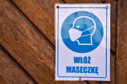 Obavezne maske u Poljskoj Pandemija virusa korona u Poljskoj. Znak za obavezno nošenje maski za lice, na poljskom jeziku.